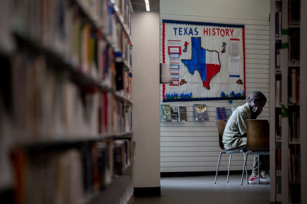 Texas residents are suing Llano County officials in federal court over the county's removal of library books addressing racism and LGBTQ issues. In this photo, a person sits in the Houston Public Library. (Photo: Brandon Bell via Getty Images)