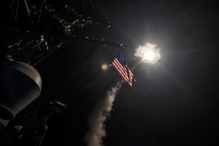 FILE PHOTO: U.S. Navy guided-missile destroyer USS Porter (DDG 78) conducts strike operations while in the Mediterranean Sea which U.S. Defense Department said was a part of cruise missile strike against Syria on April 7, 2017. Ford Williams/Courtesy U.S. Navy/Handout via REUTERS/File Photo