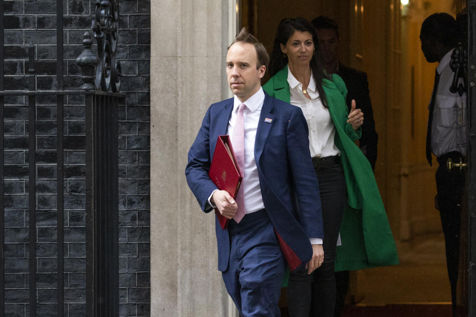 LONDON, ENGLAND  - MAY 01: Health Secretary Matt Hancock leaves 10 Downing Street with aide Gina Coladangelo after the daily press briefing on May 01, 2020 in London, England. Mr Hancock announced that the government's pledge to conduct 100,000 Covid-19 tests per day had been successful. British Prime Minister Boris Johnson, who returned to Downing Street this week after recovering from Covid-19, said the country needed to continue its lockdown measures to avoid a second spike in infections. (Photo by Dan Kitwood/Getty Images)