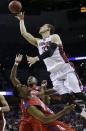 Dayton forward Dyshawn Pierre (21) falls to the court as Stanford forward Dwight Powell (33) shoots during the second half in a regional semifinal game at the NCAA college basketball tournament, Thursday, March 27, 2014, in Memphis, Tenn. (AP Photo/Mark Humphrey)