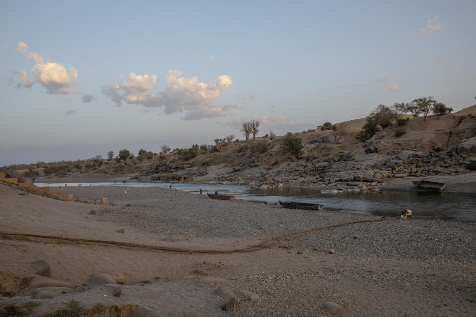 The banks of the Tekeze River, on the Sudan-Ethiopia border after Ethiopian forces blocked people from crossing into Sudan, in Hamdayet, eastern Sudan, March 16, 2021. Ethiopia is at right, and Sudan is on the left. (AP Photo/Nariman El-Mofty)