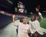 Major League Baseball's all-time career home run record holder Hank Aaron and his wife Billye take a lap in a golf cart around Turner Field in Atlanta, Thursday, April, 8, 1999, after a ceremony to mark the 25th anniversary of his breaking Babe Ruth's record of 714 home runs on April 8, 1974. (AP Photo/John Bazemore)