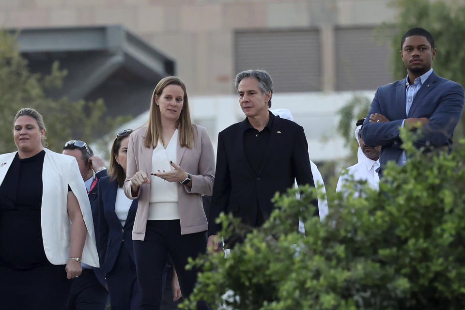 U.S. Secretary of State Anthony Blinken, center, walks alongside officials during a visit to Oxygen Park at Education City, in Doha Qatar, Monday, Nov. 21, 2022. (Karim Jaafar/Pool via AP)