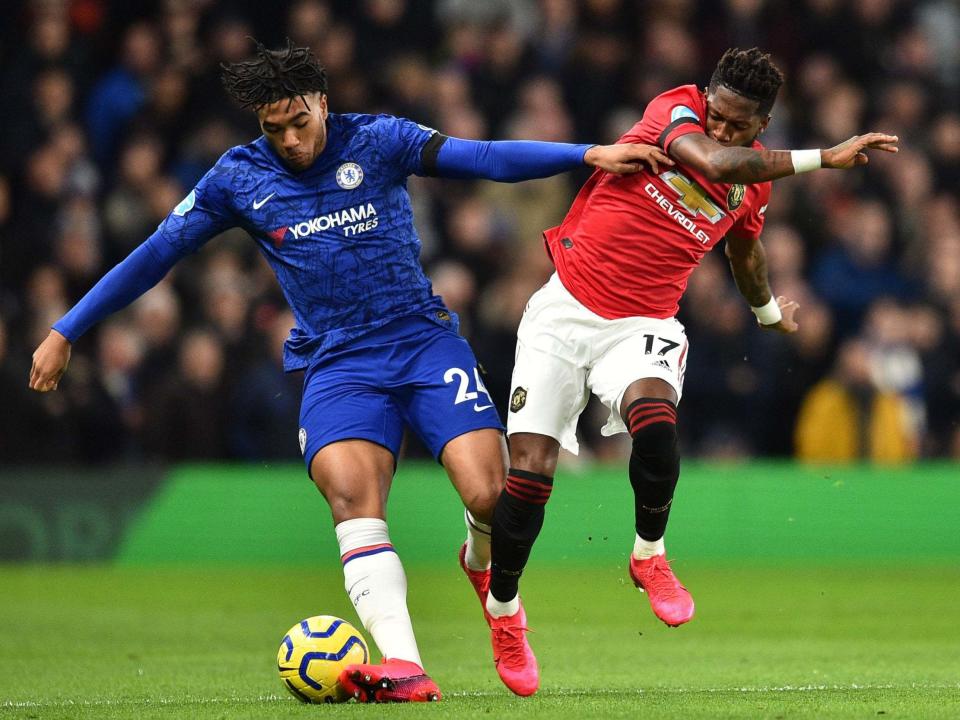 Reece James and Fred battle for the ball: Getty