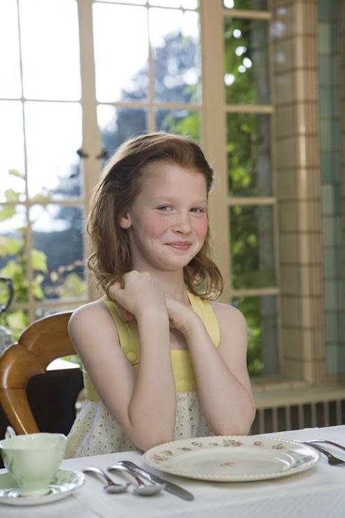 polite girl with manners at the table