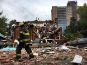 <p>A New York City firefighter walks through debris after an explosion ripped through a home in the New York City borough of the Bronx, New York on Sept. 27, 2016. (New York City Mayor’s Office/Handout via Reuters) </p>