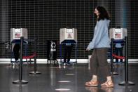 Voters line up to cast ballots on the first day of early voting in New York