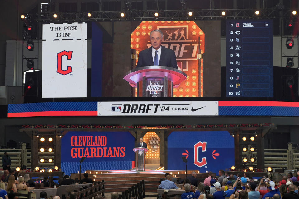 Major League Baseball Commissioner Rob Manfred announces the first-round overall selection made by the Cleveland Guardians during the MLB baseball draft in Fort Worth, Texas, Sunday, July 14, 2024. The Guardians selected Travis Bazzana. (AP Photo/LM Otero)