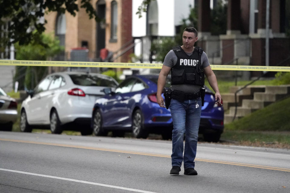 Police work near the scene of a shooting Saturday, Aug. 29, 2020, in St. Louis. The St. Louis Police Department says two of their officers have been shot and a suspect is believed to be barricaded in a house nearby. (AP Photo/Jeff Roberson)