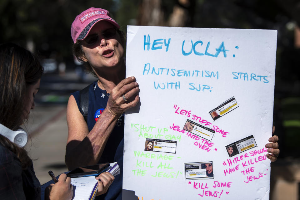 A protester holds a sign during a protest against anti-Semitism and the upcoming National Students for Justice in Palestine conference at the UCLA campus in Los Angeles, California on November 6, 2018. The Los Angeles City Council called on UCLA to cancel the NSJP conference over fears that it will promote anti-Semitism. (Photo: Ronen Tivony/NurPhoto via Getty Images)