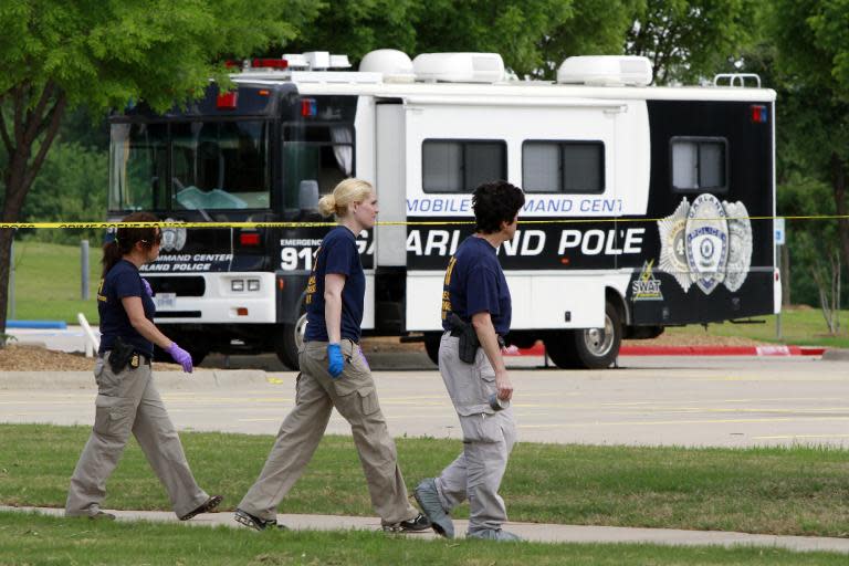 The FBI investigate the crime scene outside of the Curtis Culwell Center, where gunman Nadir Soofi was shot dead