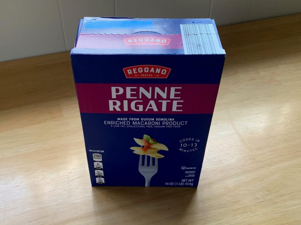 box of penne pasta on a kitchen counter