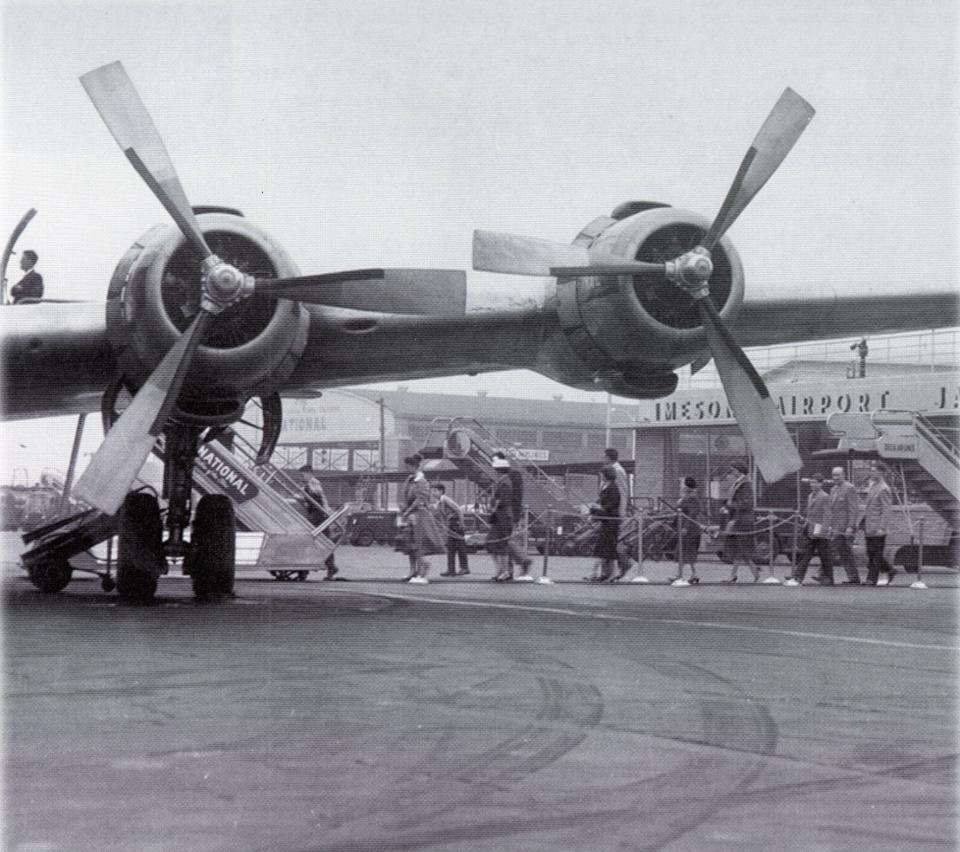 Passengers board a prop plane from the tarmac at old Imeson Airport in 1950.