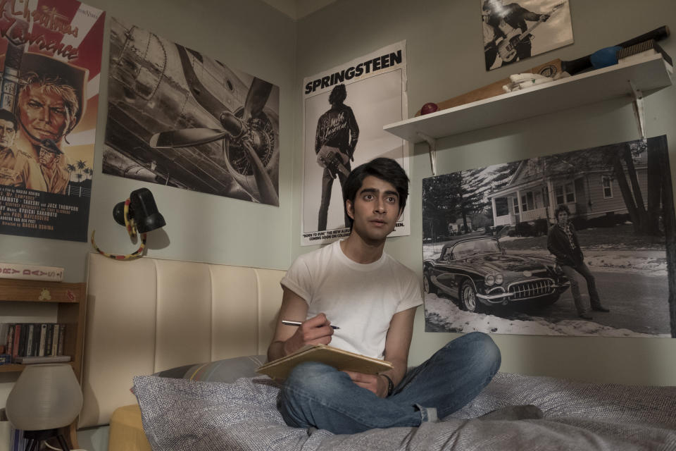 Javed, played by Viveik Kalra, writes poetry in his room while inspired by Bruce Springsteen.&nbsp; (Photo: Warner Bros)