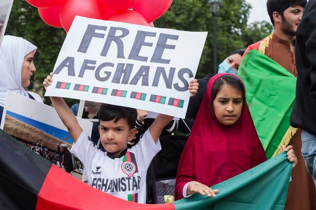 Demonstrators in Parliament Square demand help for refugees (Photo: Barcroft Media via Getty Images)