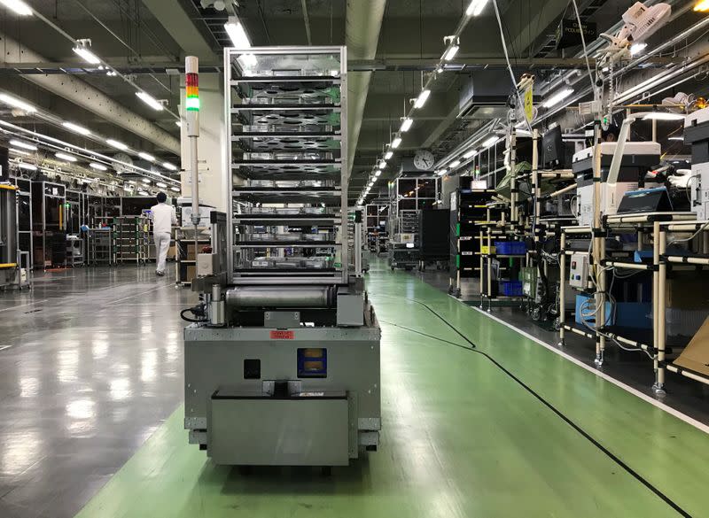 A self-driving vehicle with parts is pictued at Ricoh’s photocopier components factory in Atsugi, Japan