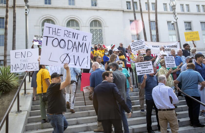LOS ANGELES, CA-July 27, 2022: People, mostly in support of ending the eviction moratorium, protest outside of Los Angeles City Hall on July 27, 2022. (Mel Melcon/Los Angeles Times)