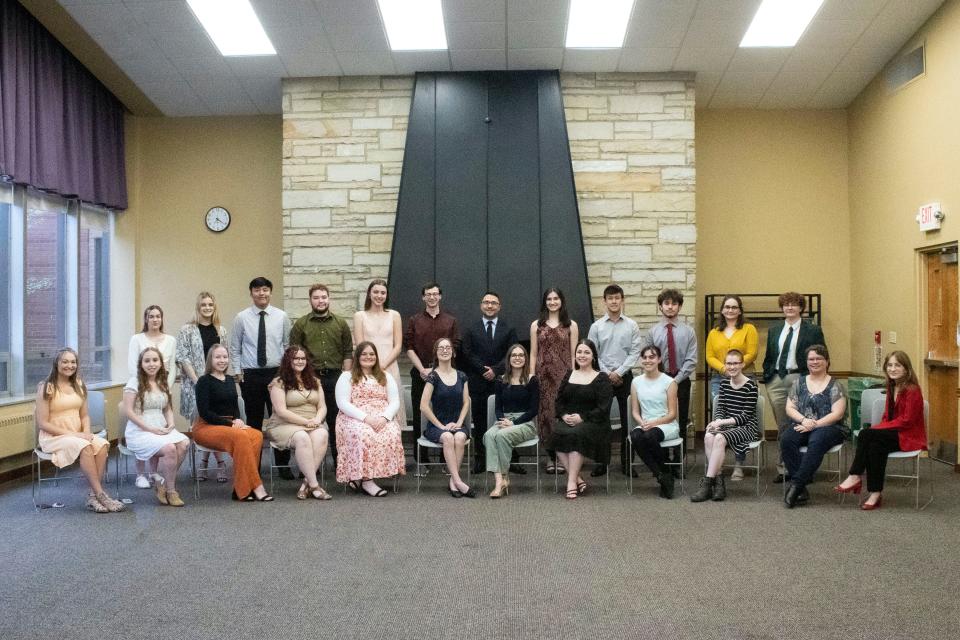 Alliance High School Class of 2022 Top 10% joined event speaker Scott Rowley, standing center in suit jacket, during the recent event at which the students honored influential teachers.