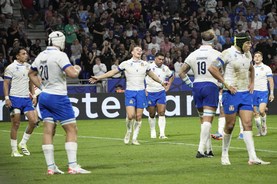 Italy's Paolo Garbisi, center, and teammates react during the Rugby World Cup Pool A match between New Zealand and Italy at the OL Stadium in Lyon, France, Friday, Sept. 29, 2023. (AP Photo/Laurent Cipriani)