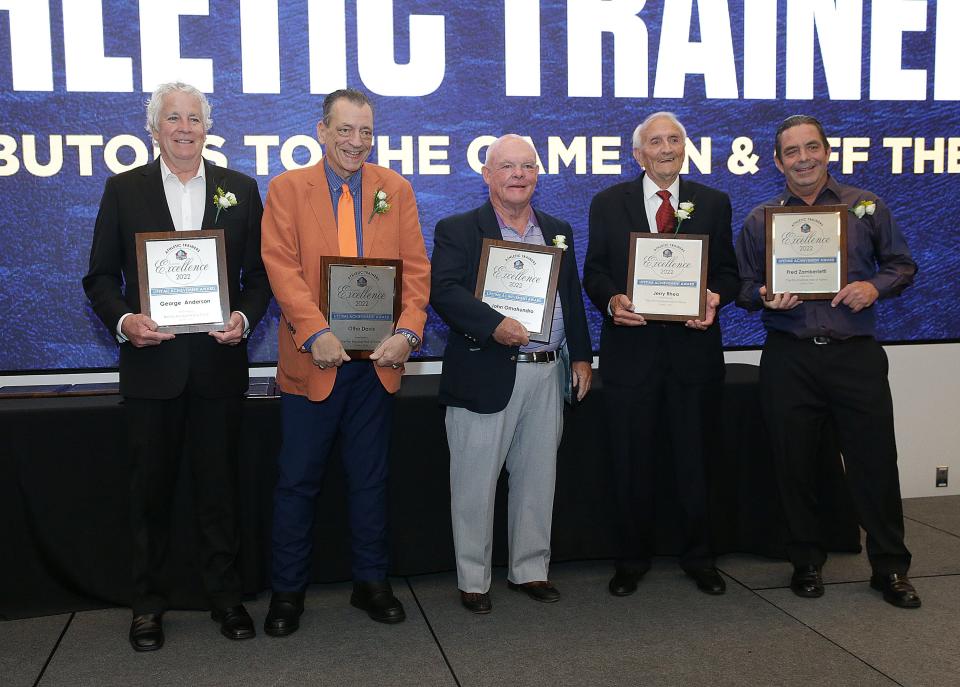 NFL athletic trainers pose for a group photo after receiving the Pro Football Hall of Fame Award of Excellence Thursday, June 30, 2022 at the Pro Football Hall of Fame.