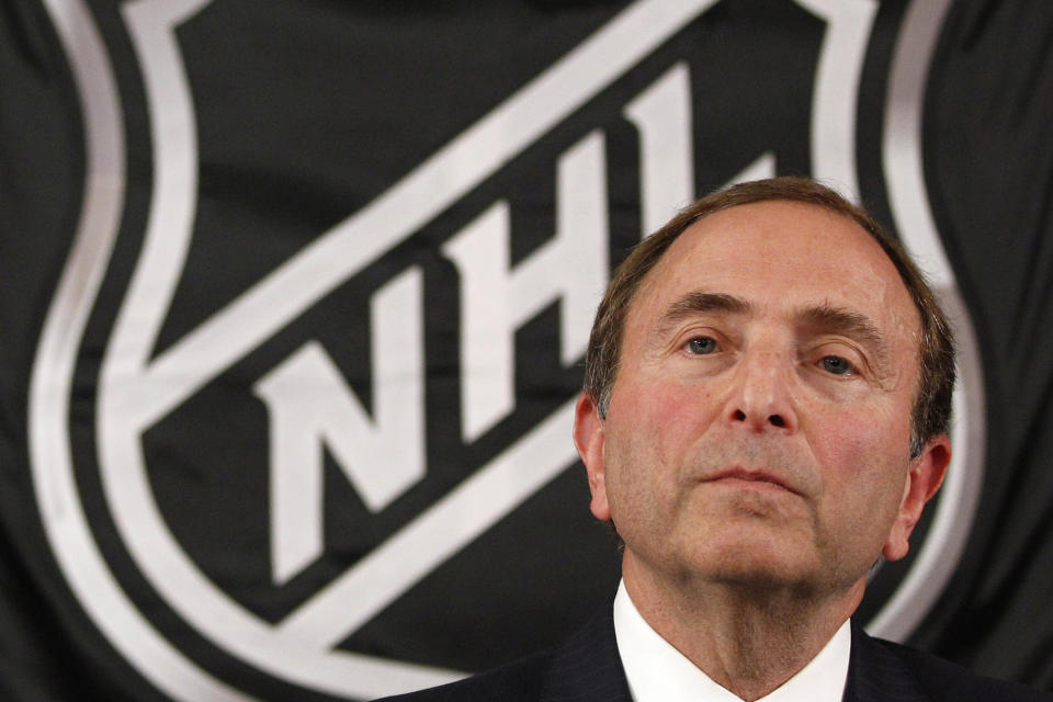 FILE - In this Sept. 13, 2012, file photo, NHL commissioner Gary Bettman listens as he meets with reporters after a meeting with team owners in New York. The National Hockey Leage Players' Association announces its decision whether to terminate the current collective bargaining agreement and set the clock ticking toward another potential work stoppage in 2020. (AP Photo/Mary Altaffer, File)