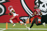 Kansas City Chiefs wide receiver Tyreek Hill (10) reacts as he beats Tampa Bay Buccaneers strong safety Antoine Winfield Jr. (31) on a 75-yard touchdown reception during the first half of an NFL football game Sunday, Nov. 29, 2020, in Tampa, Fla. (AP Photo/Mark LoMoglio)