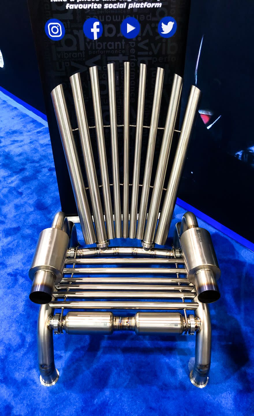 <p>Had <em>Game of Thrones</em> producers used Nissan Skylines or Toyota Supras instead of dragons as source material, this might be the Iron Throne. Vibrant Performance didn't have to vanquish their enemies to build the thing, but they did use more than 50 pieces from their lineup of titanium exhaust products to construct what's likely the most uncomfortable Adirondack chair on the porch. But it's fun. Feeling exhausted? Have a seat.</p>