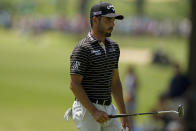 Abraham Ancer, of Mexico, walks off the green on the 13th hole during the first round of the PGA Championship golf tournament, Thursday, May 19, 2022, in Tulsa, Okla. (AP Photo/Eric Gay)