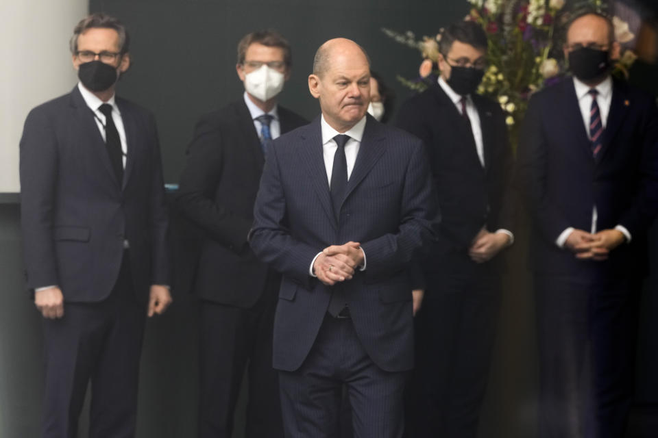 German Chancellor Olaf Scholz waits for the arrival of Lithuania's President Gitanas Nauseda for talks together with Poland's Prime Minister Mateusz Morawiecki about the Russian invasion in the Ukraine at the chancellery in Berlin, Germany, Saturday, Feb. 26, 2022. (AP Photo/Markus Schreiber)