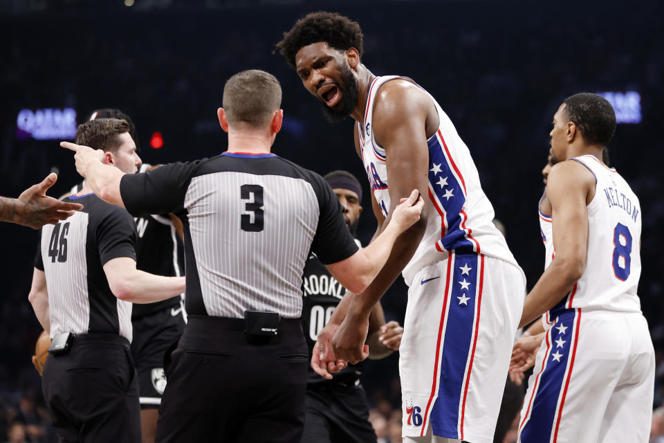NEW YORK, NEW YORK - APRIL 20: Joel Embiid #21 of the Philadelphia 76ers reacts toward referee Nick Buchert #3 against the Brooklyn Nets during the first half of Game Three of the Eastern Conference First Round Playoffs at Barclays Center on April 20, 2023 in the Brooklyn borough of New York City. NOTE TO USER: User expressly acknowledges and agrees that, by downloading and or using this photograph, User is consenting to the terms and conditions of the Getty Images License Agreement. (Photo by Sarah Stier/Getty Images)