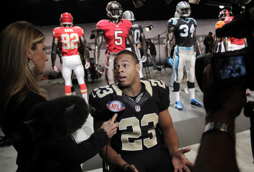 New Orleans Saints' Pierre Thomas talks to a reporter at a presentation in New York, Tuesday, April 3, 2012. The NFL  and Nike showed off the new gear in grand style with a gridiron-themed fashion show at a Brooklyn film studio. (AP Photo/Seth Wenig)