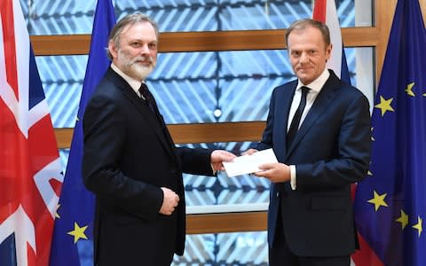 The moment Britain's ambassador to the EU Tim Barrow delivered Mrs May's formal notice of the UK's intention to leave the bloc under Article 50. - Credit: AFP