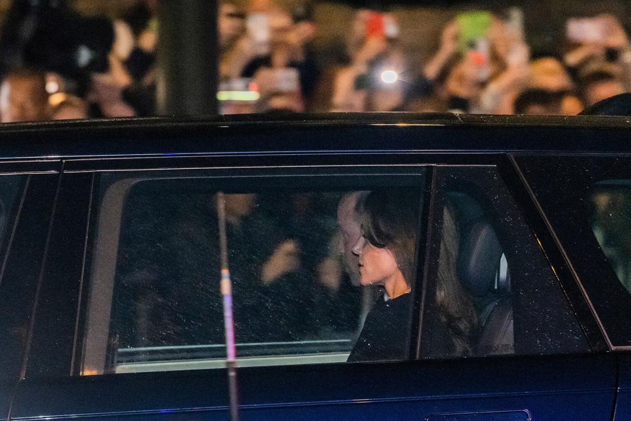 Mandatory Credit: Photo by Guy Bell/Shutterstock (13388500o) William and Kate, the Duke and Catherine Princess of Wales, arrive just before the hearse convoy - The hearse carrying the coffin of Queen Elizabeth II arrives at Hyde Park Corner on its way to Buckingham Palace. The coffin of Queen Elizabeth II arrives at Hyde Park Corner., Hyde Park Corner, London, UK - 13 Sep 2022