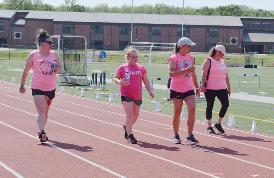 "The Bravehearts" finish a lap during Saturday's Relay for Life in Greencastle, Pa. From left are Niki Maynard, Lakelyn Maynard, Angie Maynard and Sharon Zeis.