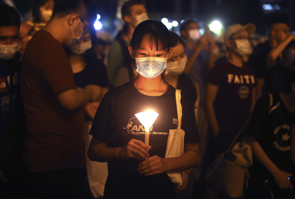 Hundreds of participants attend a candlelight vigil at Democracy Square in Taipei, Taiwan, Thursday, June 4, 2020, to mark the 31st anniversary of the Chinese military crackdown on the pro-democracy movement in Beijing's Tiananmen Square. (AP Photo/Chiang Ying-ying)