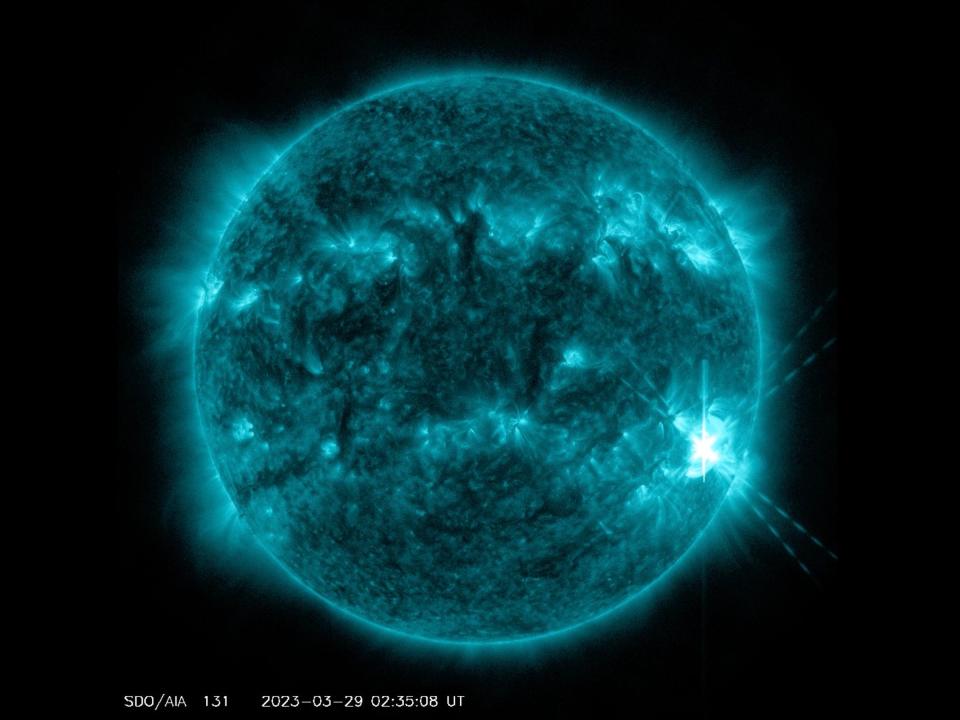the sun in blue showing flares and eruptions