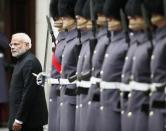 Prime Minister Narendra Modi's inspects an honour guard during his official visit, in London, November 12, 2015. REUTERS/Stefan Wermuth