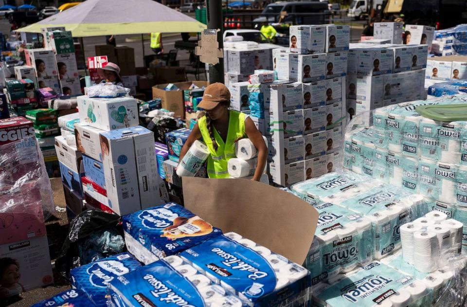 PHOTO: A volunteers works at a food and supply distribution center set up in the parking lot of a shopping mall in Lahaina, Hawaii, Aug. 16, 2023. (Jae C. Hong/AP, FILE)