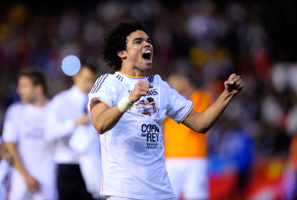 Real's Pepe celebrates at the end of the final of the Copa del Rey between FC Barcelona and Real Madrid at the Mestalla stadium in Valencia, Spain, Wednesday, April 16, 2014. Real defeated Barcelona 2-1. (AP Photo/Manu Fernandez)
