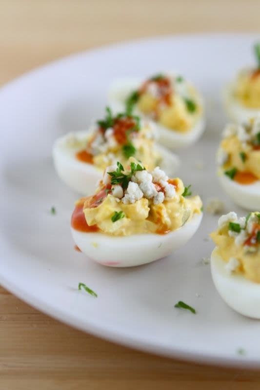 <p>Lauren's Latest</p><p>A new and spicy spin on the classic. Buffalo deviled eggs are made with blue cheese and hot sauce, so good!</p><p><strong>Get the recipe: <a href="https://laurenslatest.com/buffalo-blue-cheese-deviled-eggs-easter-recipes/" rel="nofollow noopener" target="_blank" data-ylk="slk:Buffalo Blue Cheese Deviled eggs;elm:context_link;itc:0;sec:content-canvas" class="link ">Buffalo Blue Cheese Deviled eggs</a></strong></p>
