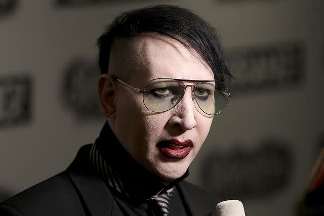 Marilyn Manson fined for blowing nose on concert camerawoman - BBC News