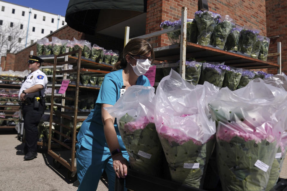 Abbott Northwestern Hospital used carts to deliver some of the 1,500 flowering spring plants donated by Bachman's Floral, Home & Garden in appreciation of the efforts of health care workers responding to the Coronavirus pandemic Tuesday, March 31, 2020 in Minneapolis. (Anthony Souffle/Star Tribune via AP)