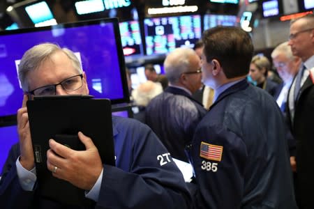 Traders work on the main trading floor after opening bell at New York Stock Exchange (NYSE) in New York