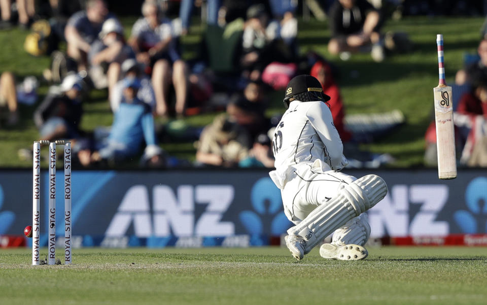 New Zealand's Tom Blundell falls as he is hit by the ball during play on day one of the second cricket test between New Zealand and India at Hagley Oval in Christchurch, New Zealand, Saturday, Feb. 29, 2020. (AP Photo/Mark Baker)