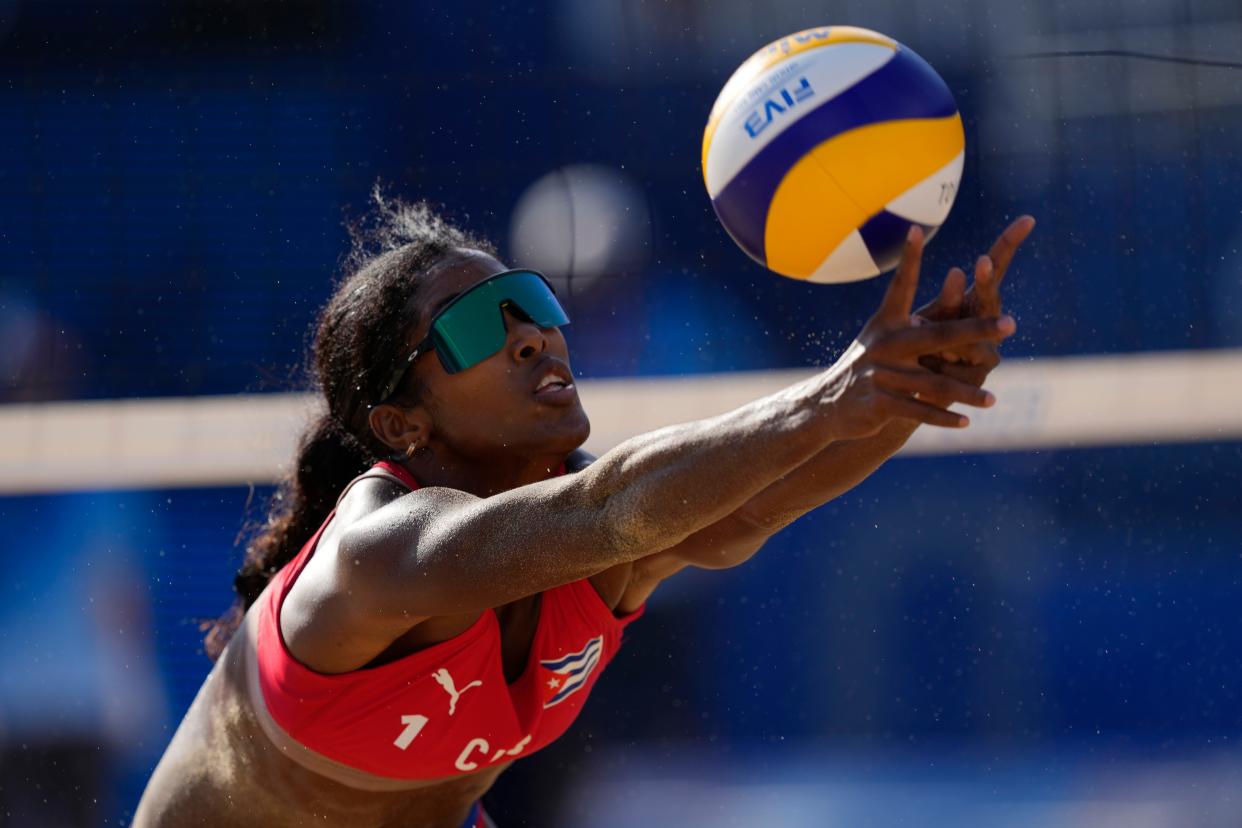 Lidianny Echevarria Benitez, of Cuba, returns a shot during a women's beach volleyball match against the Russian Olympic Committee at the 2020 Summer Olympics, Wednesday, July 28, 2021, in Tokyo, Japan.