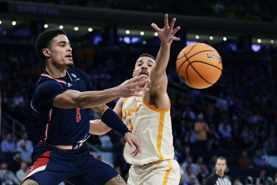 Florida Atlantic guard Bryan Greenlee (4) passes as Tennessee guard B.J. Edwards (1) defends during the first half of a Sweet 16 college basketball game in the East Regional of the NCAA tournament at Madison Square Garden, Thursday, March 23, 2023, in New York. (AP Photo/Adam Hunger)