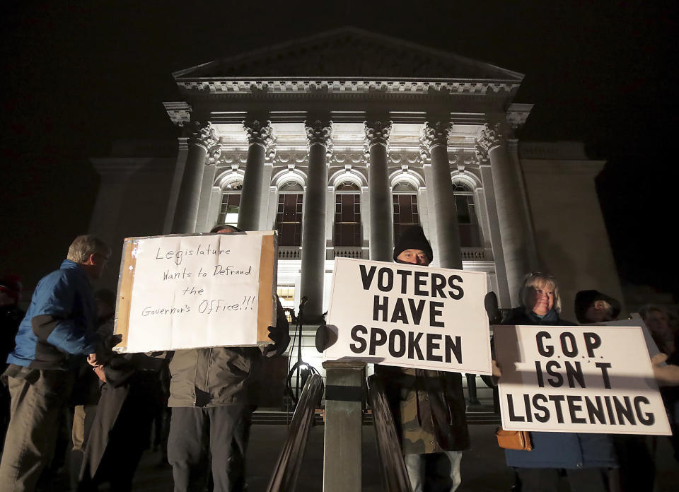 Opponents of an extraordinary session bill submitted by Wisconsin Republican legislators gather for a rally outside the Wisconsin state Capitol in Madison, Wis., Monday. (Photo: John Hart/Wisconsin State Journal via AP)