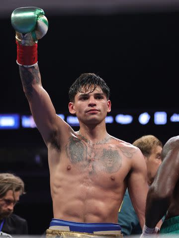 <p>Carmen Mandato/Getty</p> Ryan Garcia celebrates defeating Emmanuel Tagoe at the Alamodome on April 09, 2022 in San Antonio, Texas.