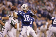 File-This Jan. 8, 2011, file photo shows Indianapolis Colts quarterback Peyton Manning (18) in action during the second quarter of an NFL AFC wild card football playoff game in Indianapolis. Members of a special panel of 26 selected all of them for the position as part of the NFL's celebration of its 100th season. All won league titles except Marino. All are in the Hall of Fame except Brady and Manning, who are not yet eligible. On Friday, Dec. 27, 2019, quarterback was the final position revealed for the All-Time Team. (AP Photo/Nam Y. Huh,File)