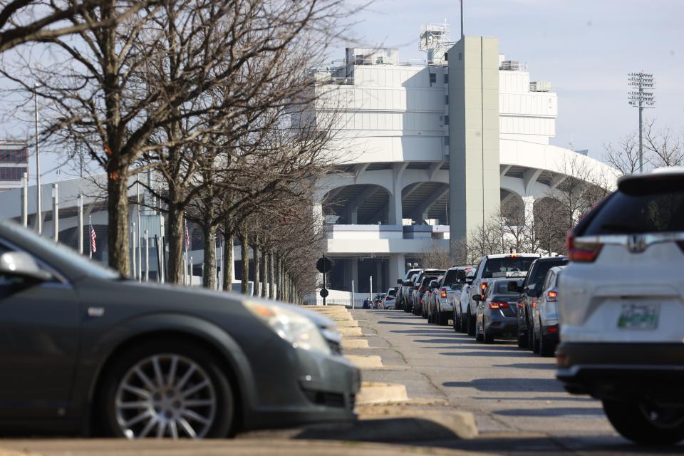 Cars line up outside Liberty Bowl Memorial Stadium for COVID-19 vaccinations in the Pipkin Building on Jan. 27.